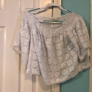 Off the shoulder white top with floral patterning